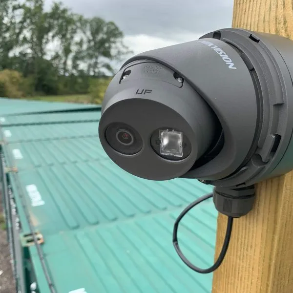 Hikvision dome camera mounted on a timber post